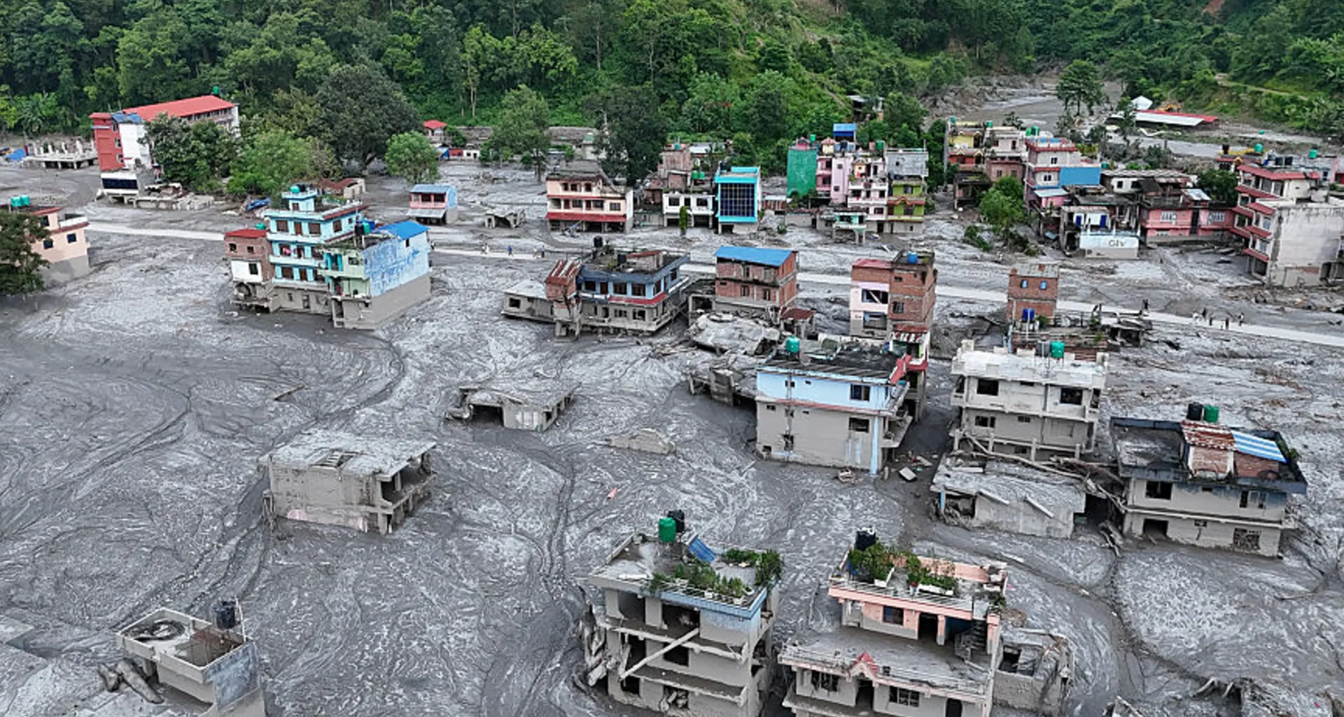 An Aerial view shows debris and mud covering settlements following flash floods on August 28, 2026 in DevGhat village, Nepal.Ritesh Shukla—Getty Images